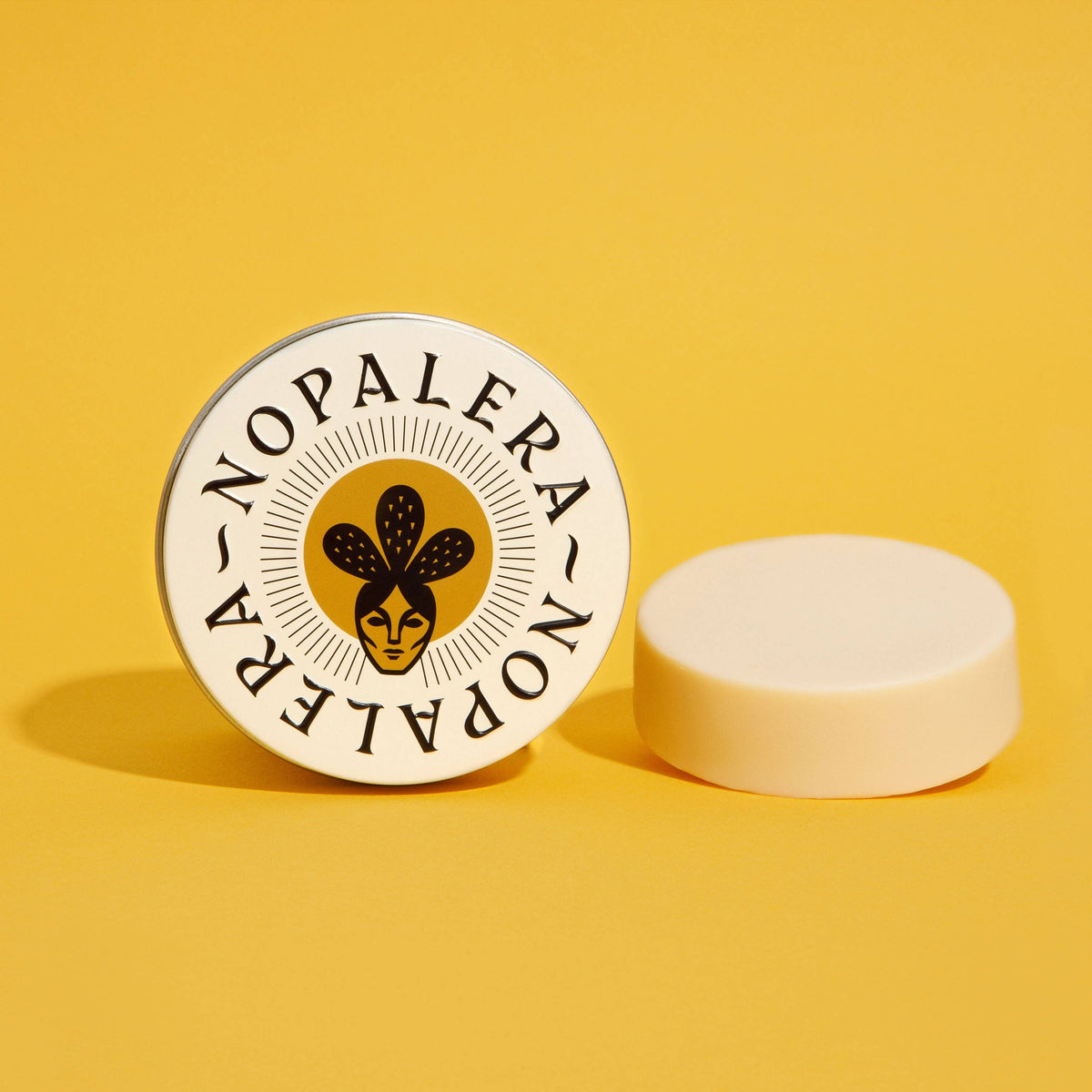 Nopalera lotion bar with a yellow background