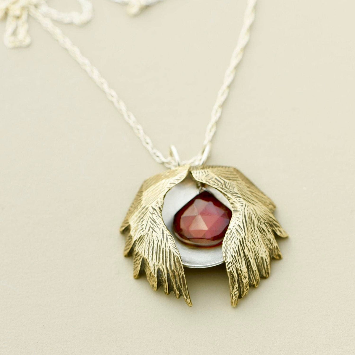 Bronze, silver and carnelian necklace with wings