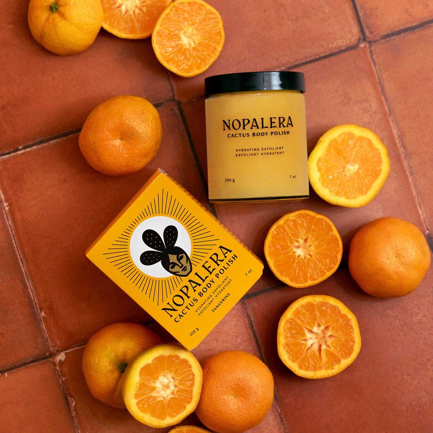 Nopalera cactus body polish with oranges on a terracotta surface