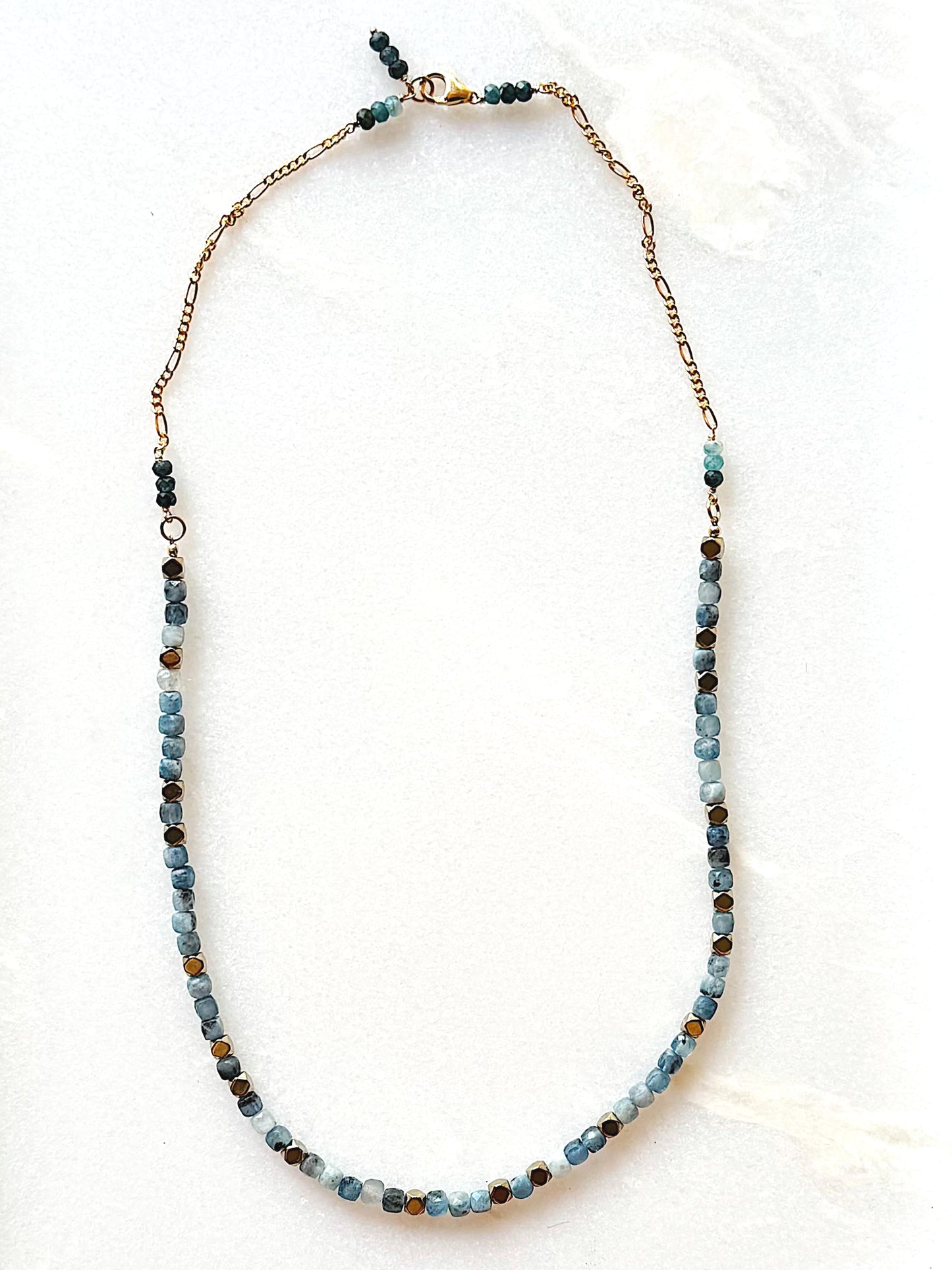 Necklace with blue beads on a white background