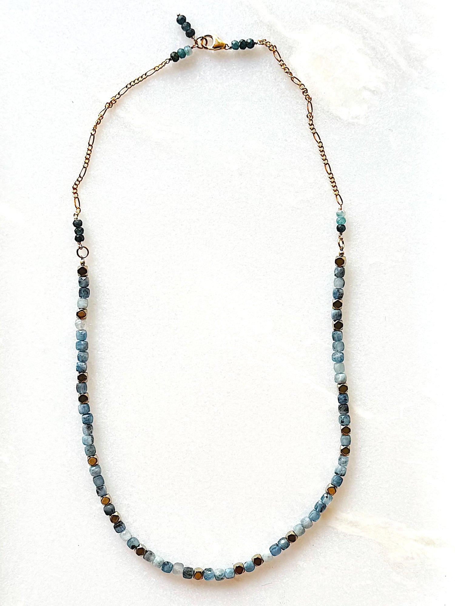 Necklace with blue beads on a white background