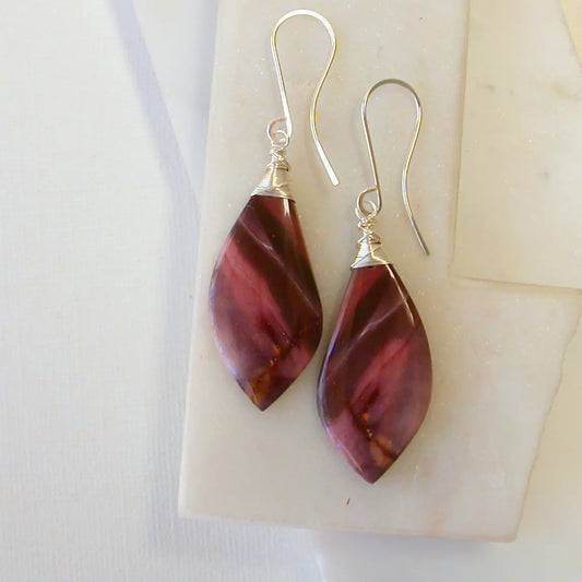 Pair of maroon mookite jasper teardrop earrings on a white background