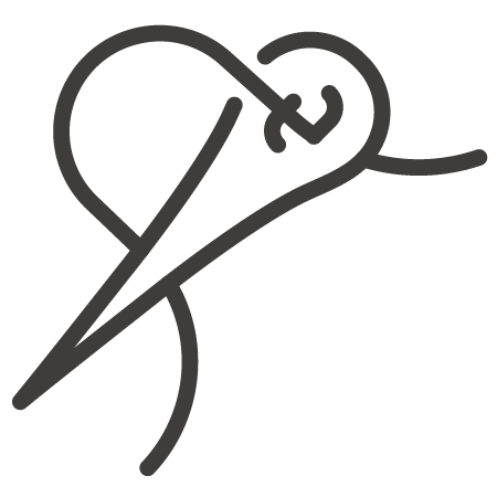 A needle with a thread going through the eye hole.